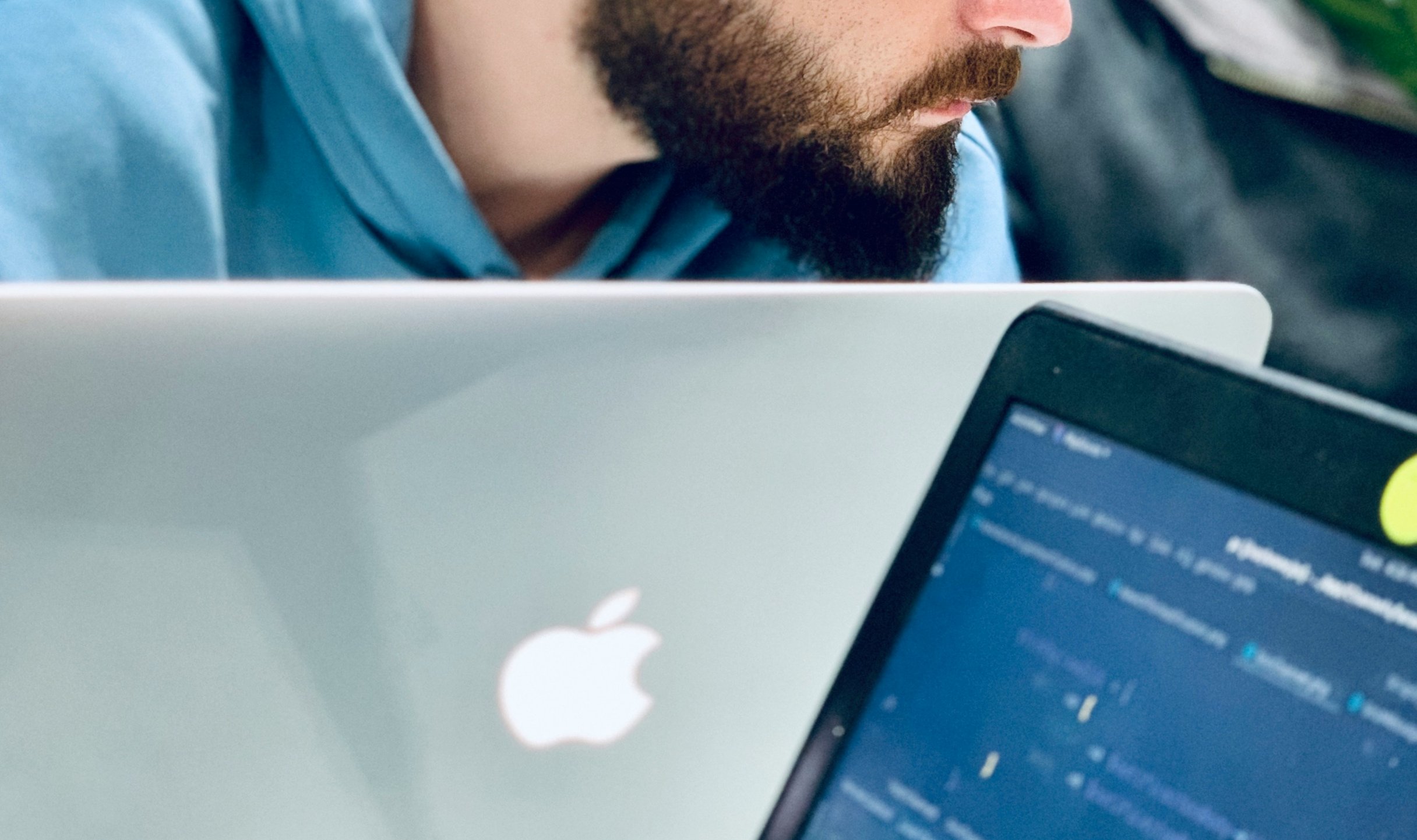 Software developers sitting with their apple computers